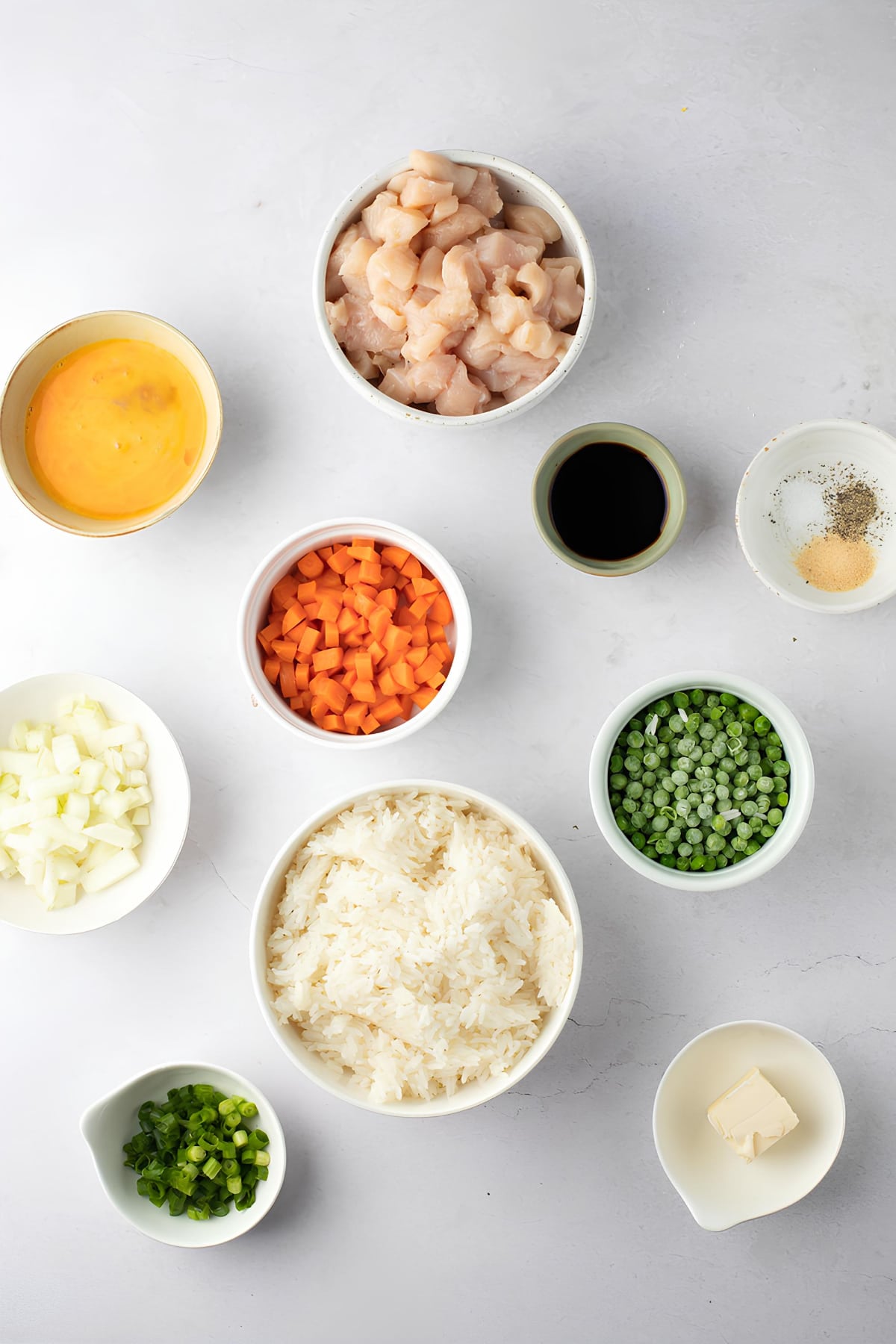 Chicken Fried Rice Ingredients - Butter, Cooked White Rice, Veggies, Eggs, Garlic Powder, Soy Sauce, Boneless Chicken Breast