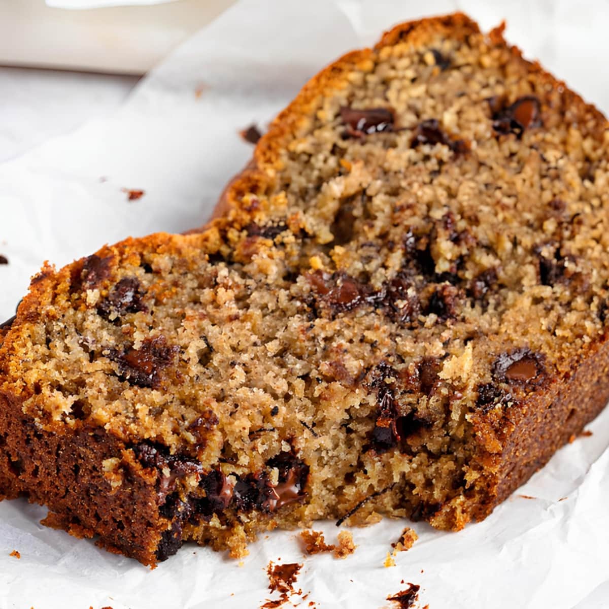 Chocolate chip banana bread on a piece of parchment paper