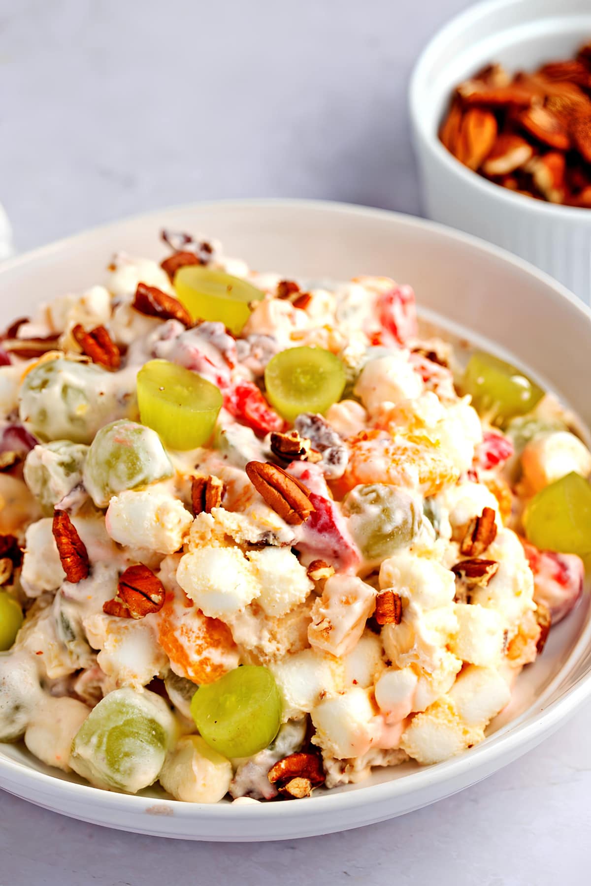 Colorful Christmas Fruit Salad with Grapes, Cherries, Mini-Marshmallows and Pecan Nuts