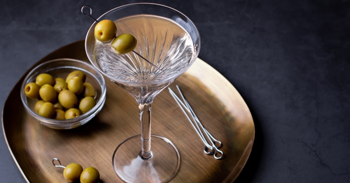 Dirty Martini Cocktail in a Wine Glass with Olives