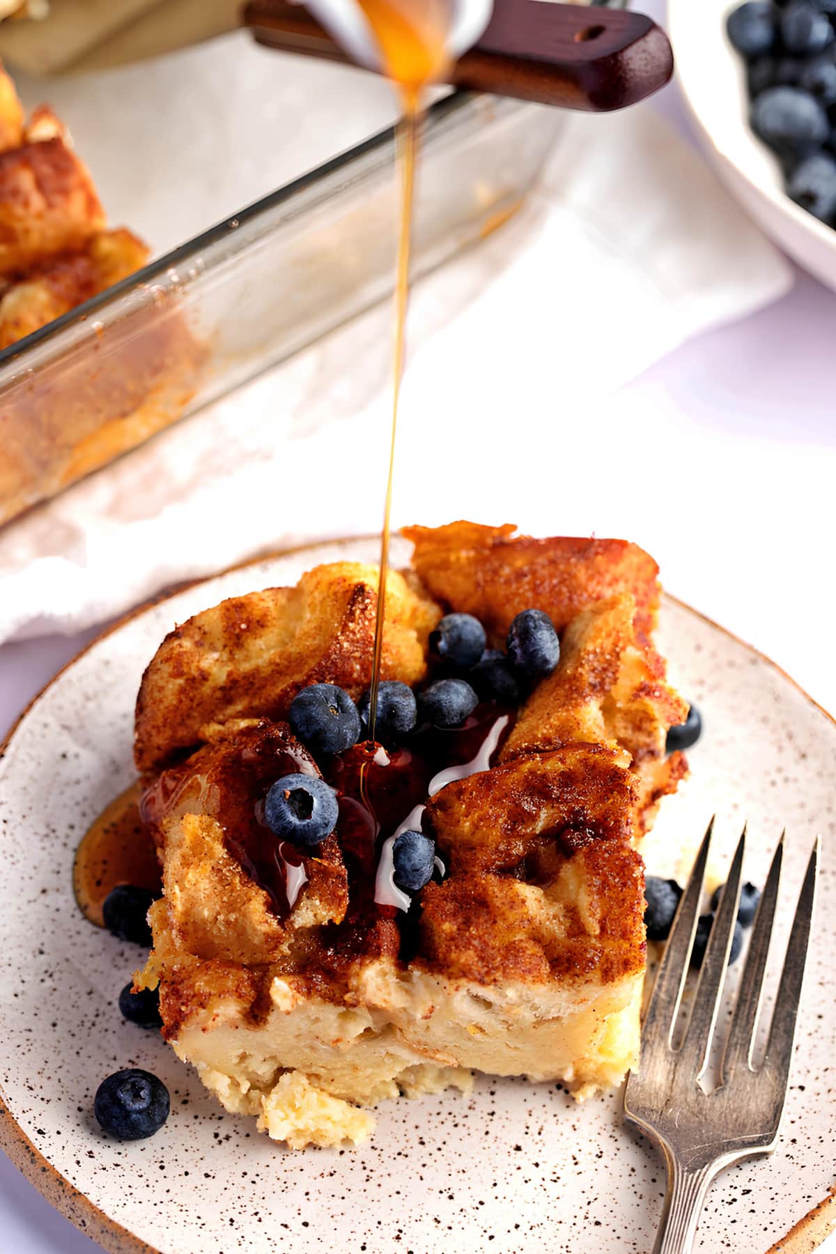 Dripping Syrup into a Sliced French Toast with Blueberries