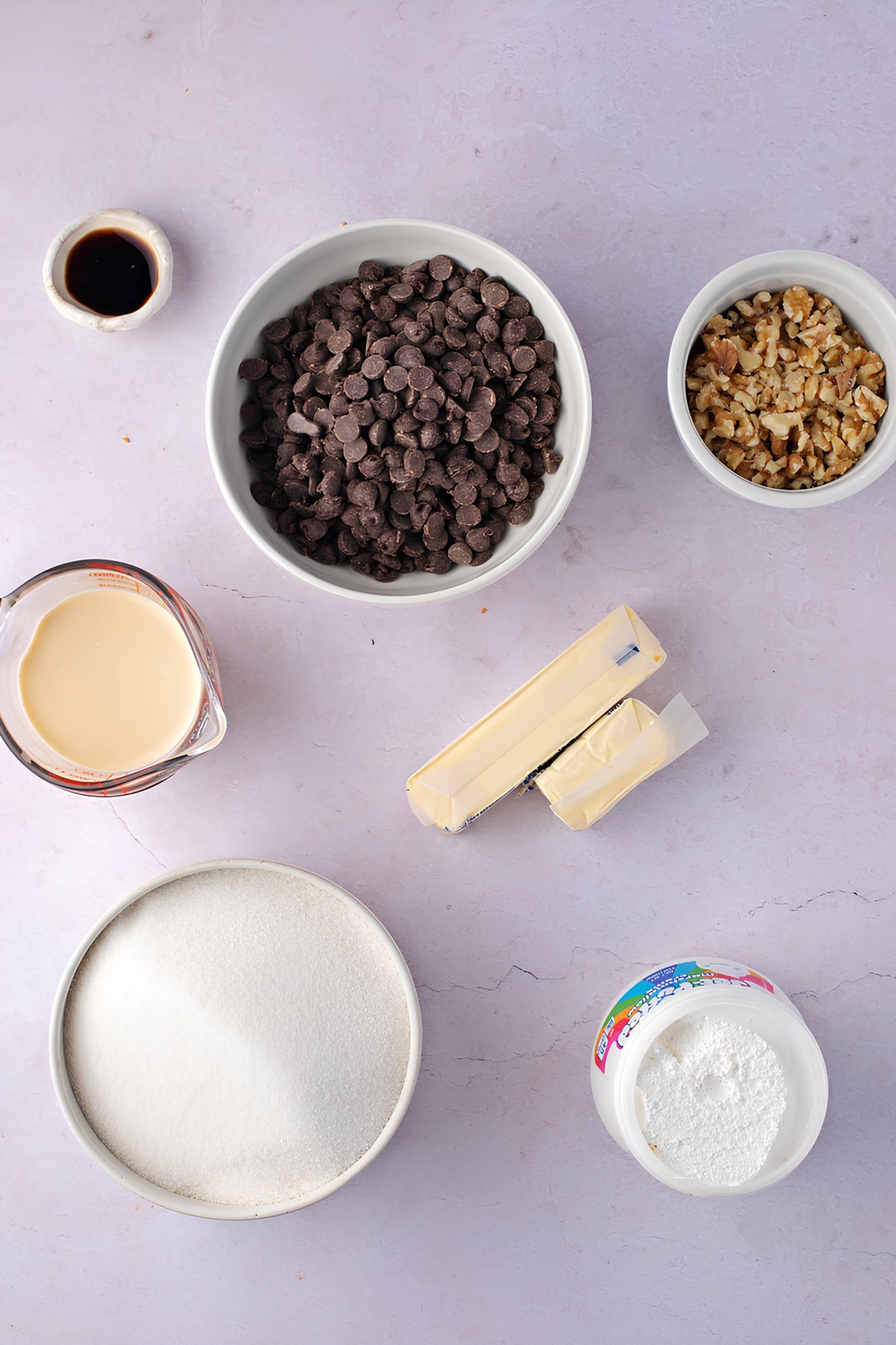 Fantasy Fudge Ingredients - White Sugar, Margarine, Milk, Chocolate Chips, Marshmallow Cream, Chopped Walnuts, and Vanilla Extract