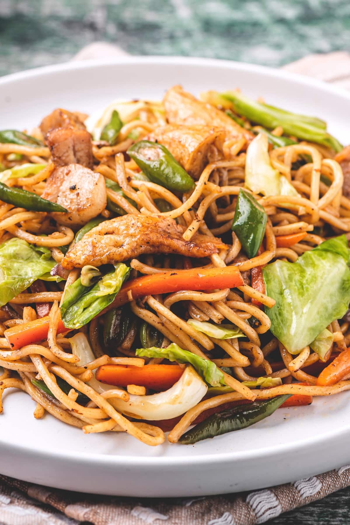 Filipino Pancit with Pork and Vegetables Including Carrots, Cabbage and Green Beans