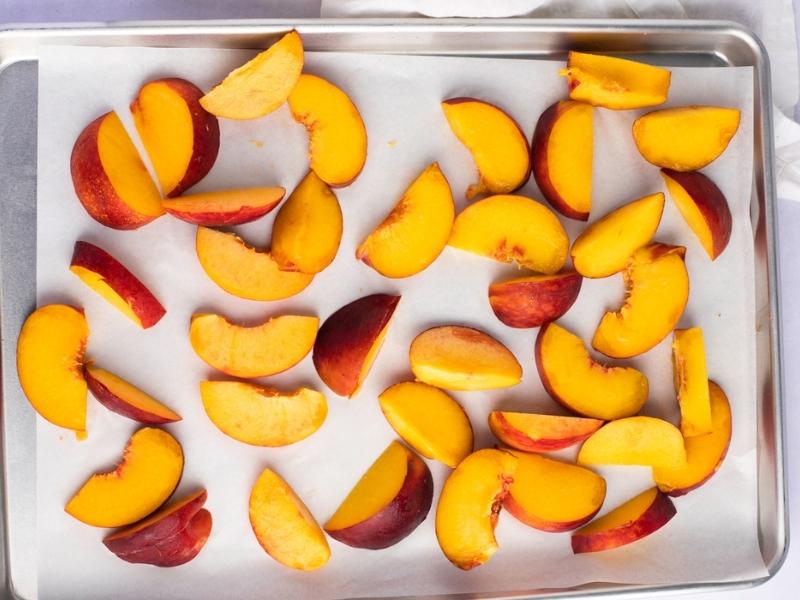Freshly Drained Peaches on a Parchment Paper