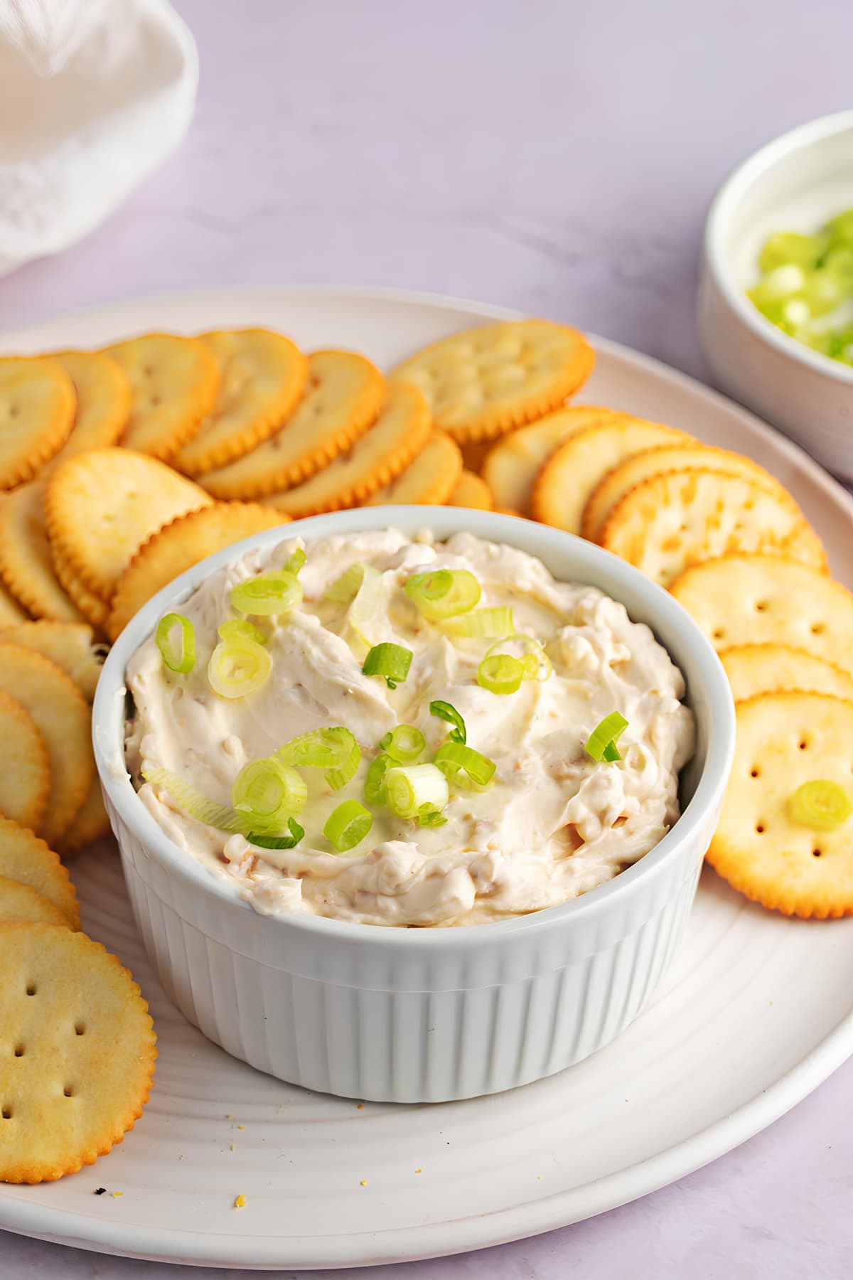 Homemade Clam Dip Topped with Onions Served with Biscuits