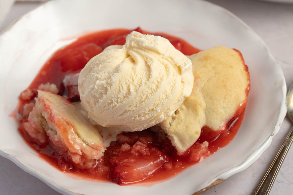 Homemade Strawberry Cobbler in a Plate with Ice Cream