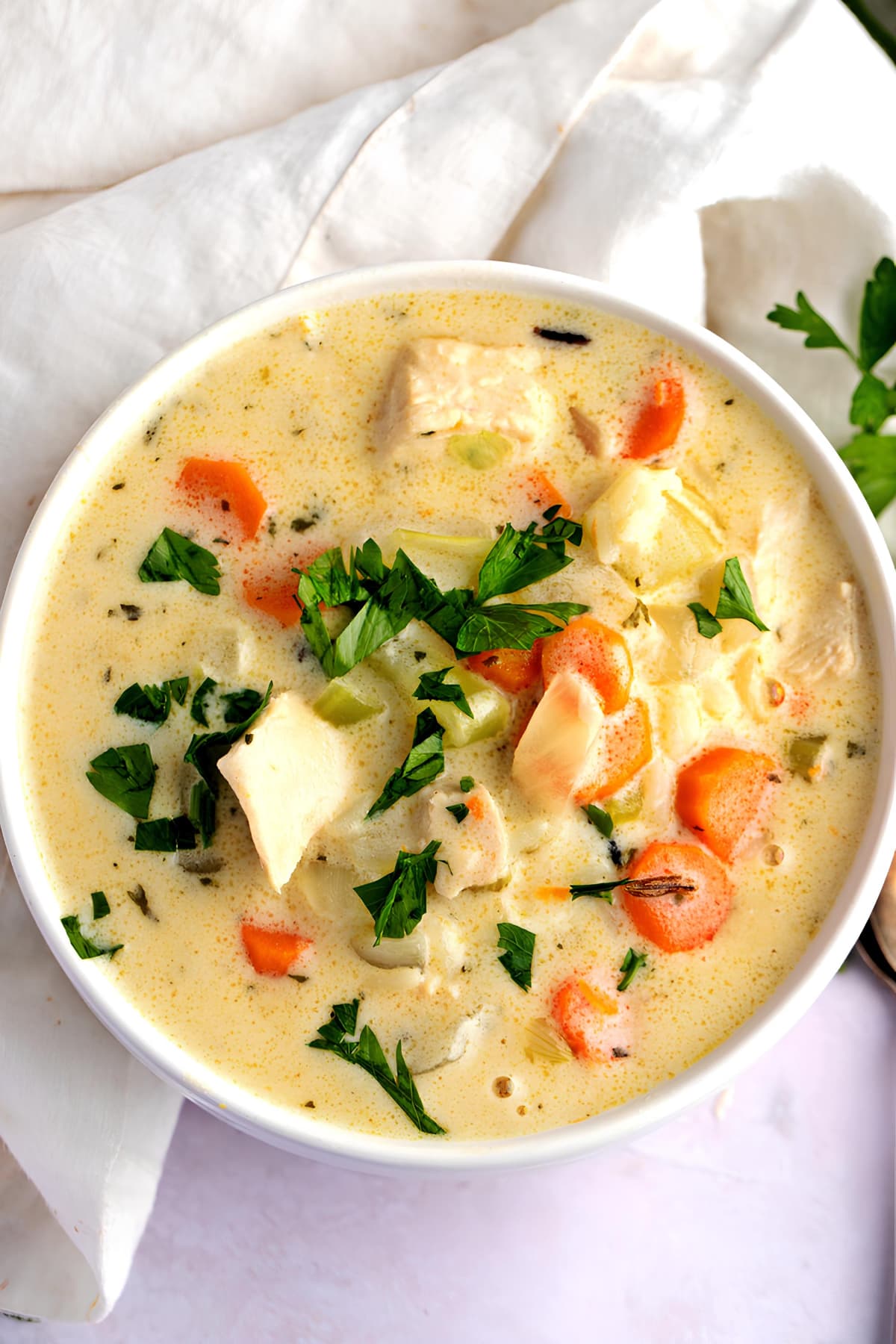 https://insanelygoodrecipes.com/wp-content/uploads/2023/10/Panera-Cream-of-Chicken-and-Wild-Rice-Soup-in-a-Bowl.jpg