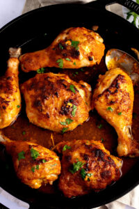 Peri Peri Chicken with Herbs in a Black Skillet