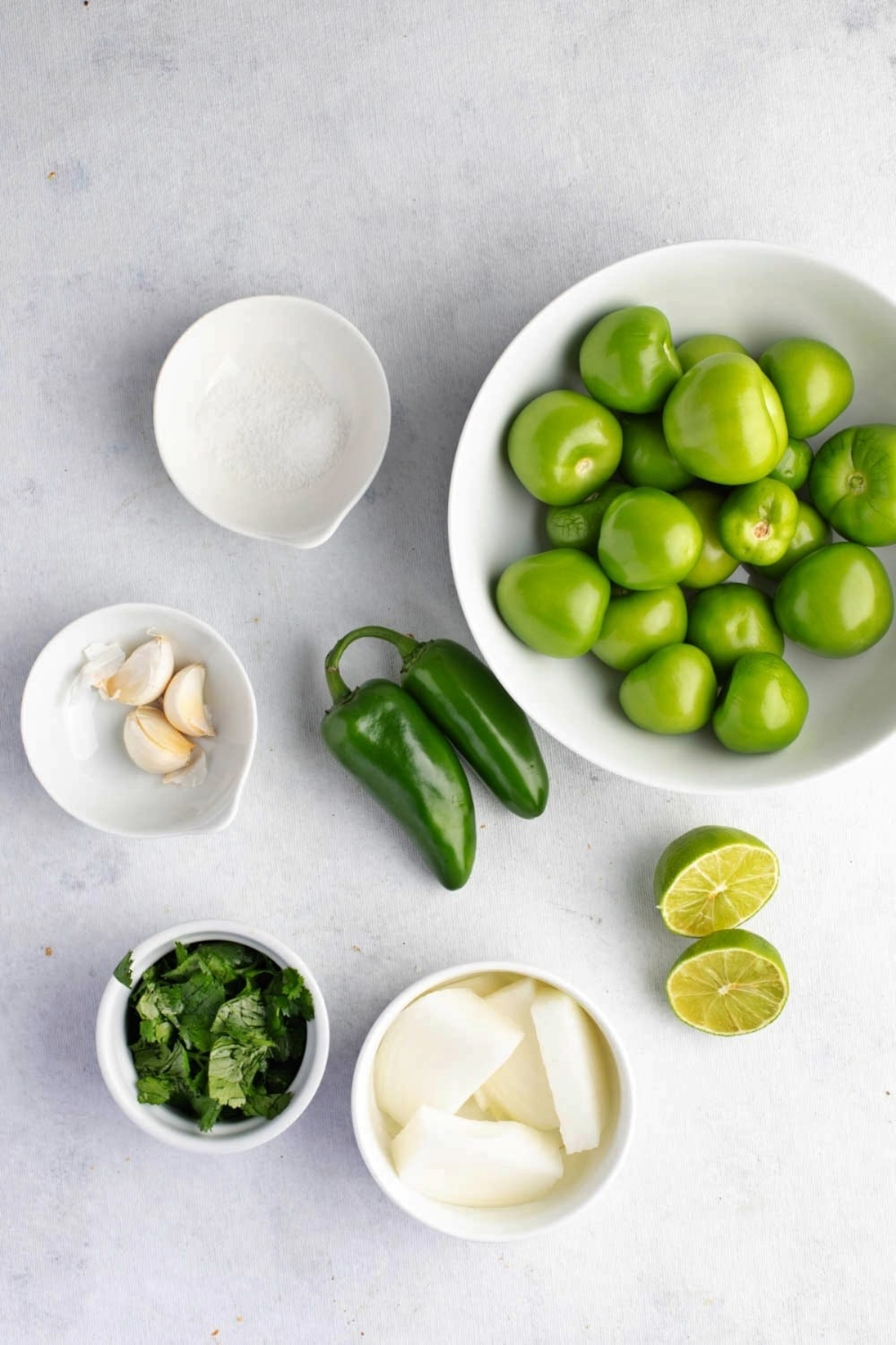 Salsa Verde Ingredients on a White Marble Surface