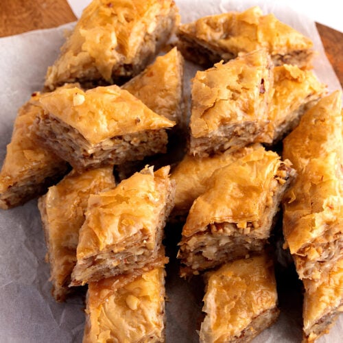 https://insanelygoodrecipes.com/wp-content/uploads/2023/10/Several-Pieces-of-Baklava-on-a-Parchment-Paper-500x500.jpg