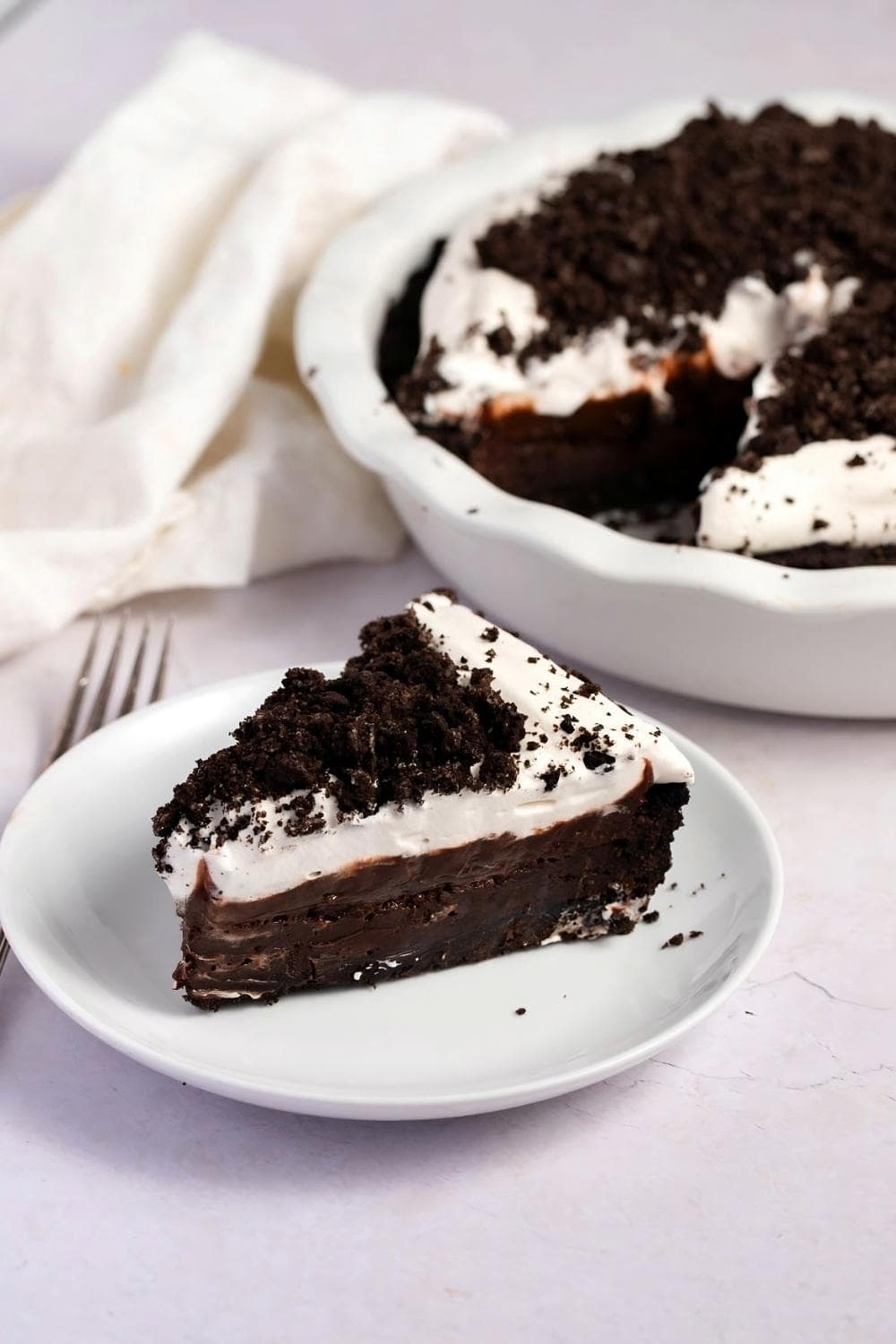 A slice of Mississippi Mud Pie with crushed Oreo pieces