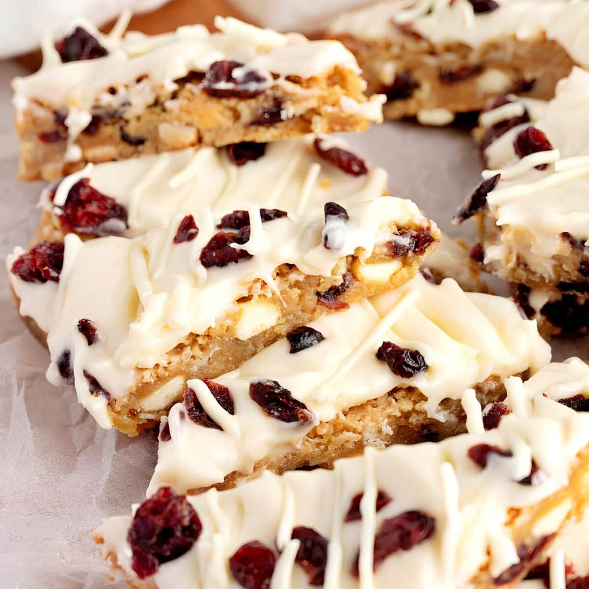 Sliced Cranberry Bliss bars, Topped With White Chocolate Drizzle
