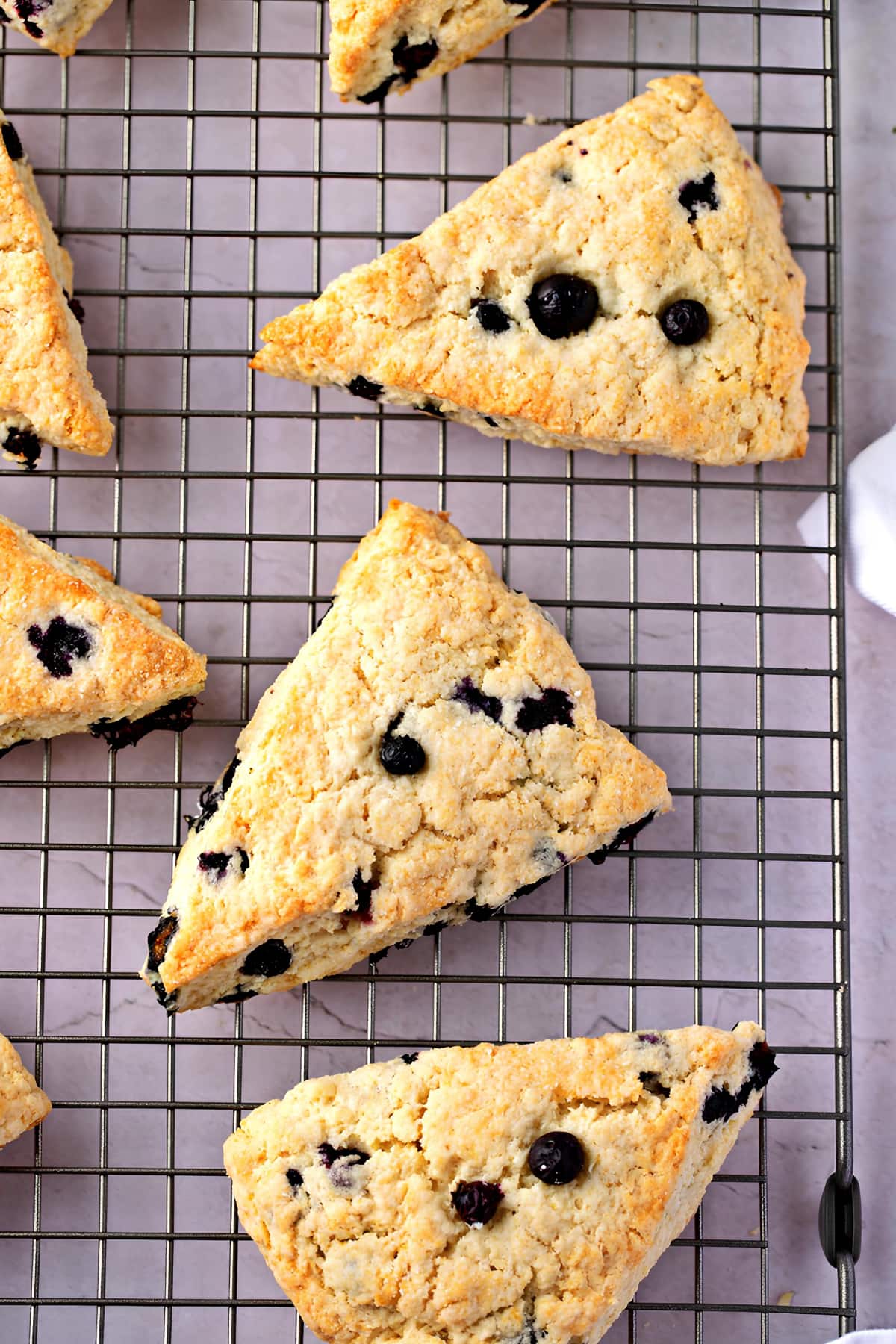 Sliced Scones in a Cooling Rack with Blueberries
