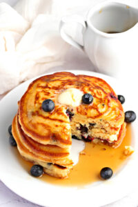 Soft and Fluffy Homemade Blueberry Pancakes with Butter and Maple Syrup