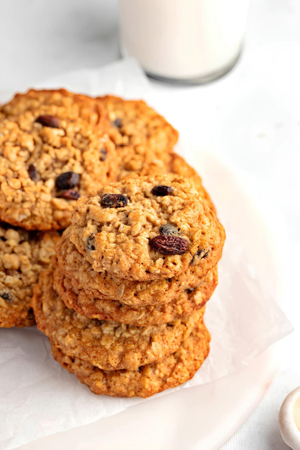 Stacks Oatmeal Raisin Cookies on a Plate with Parchment Paper