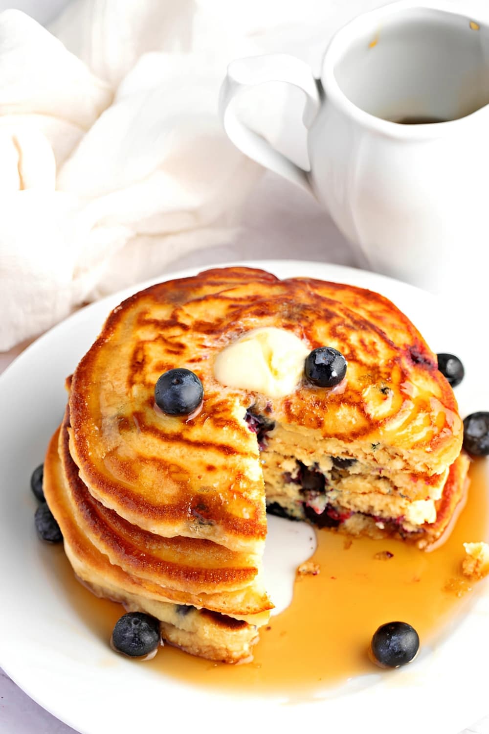 Stacks of Blueberry Pancakes on a Round Plate