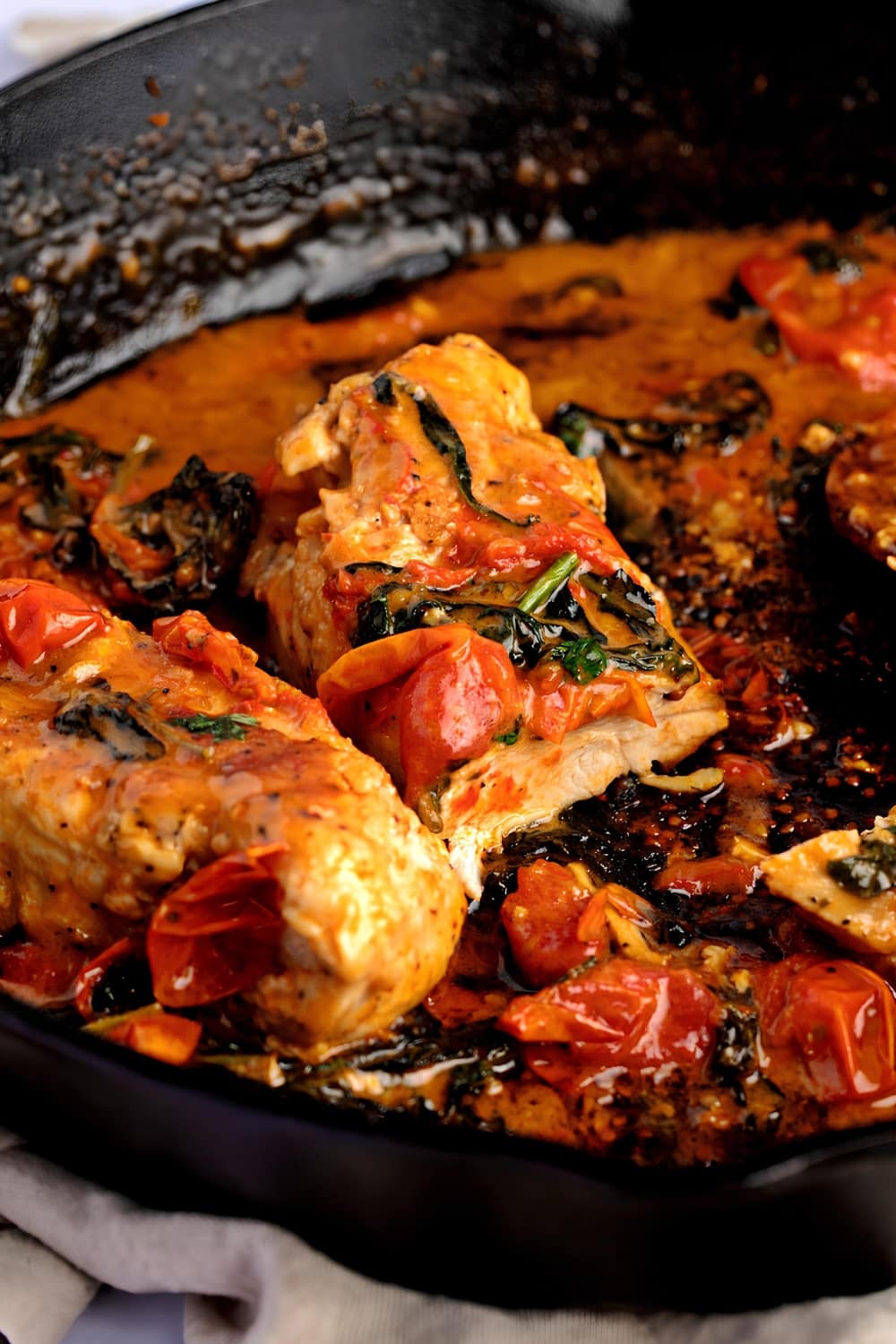 Saucy Tuscan chicken with cherry tomatoes and spinach