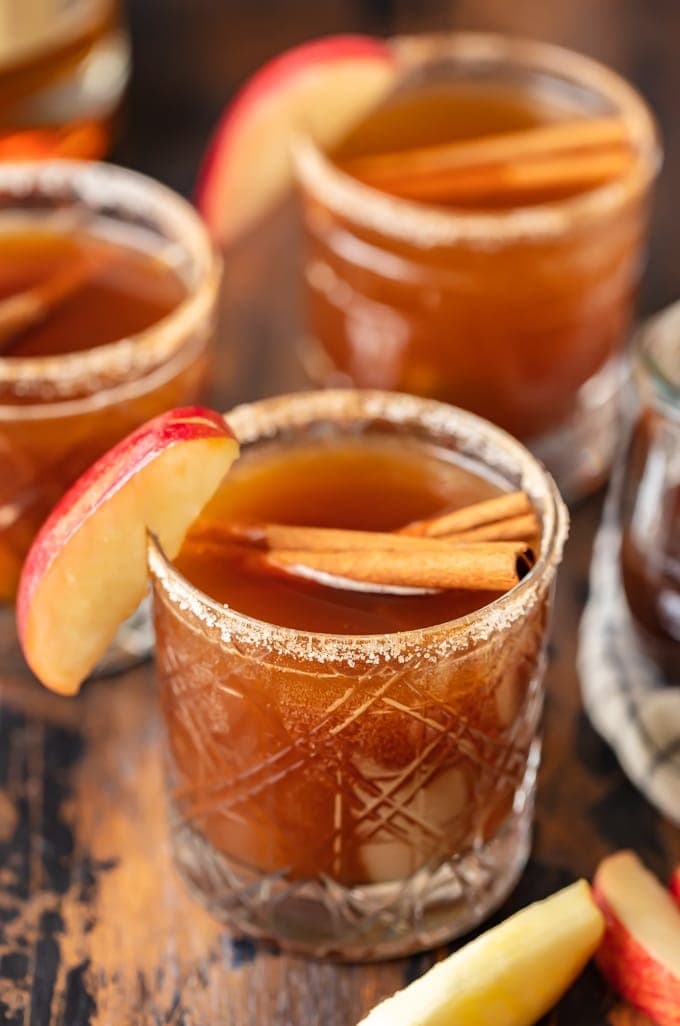  Glass of Apple Butter Old Fashioned garnished with apple wedges and cinnamon sticks