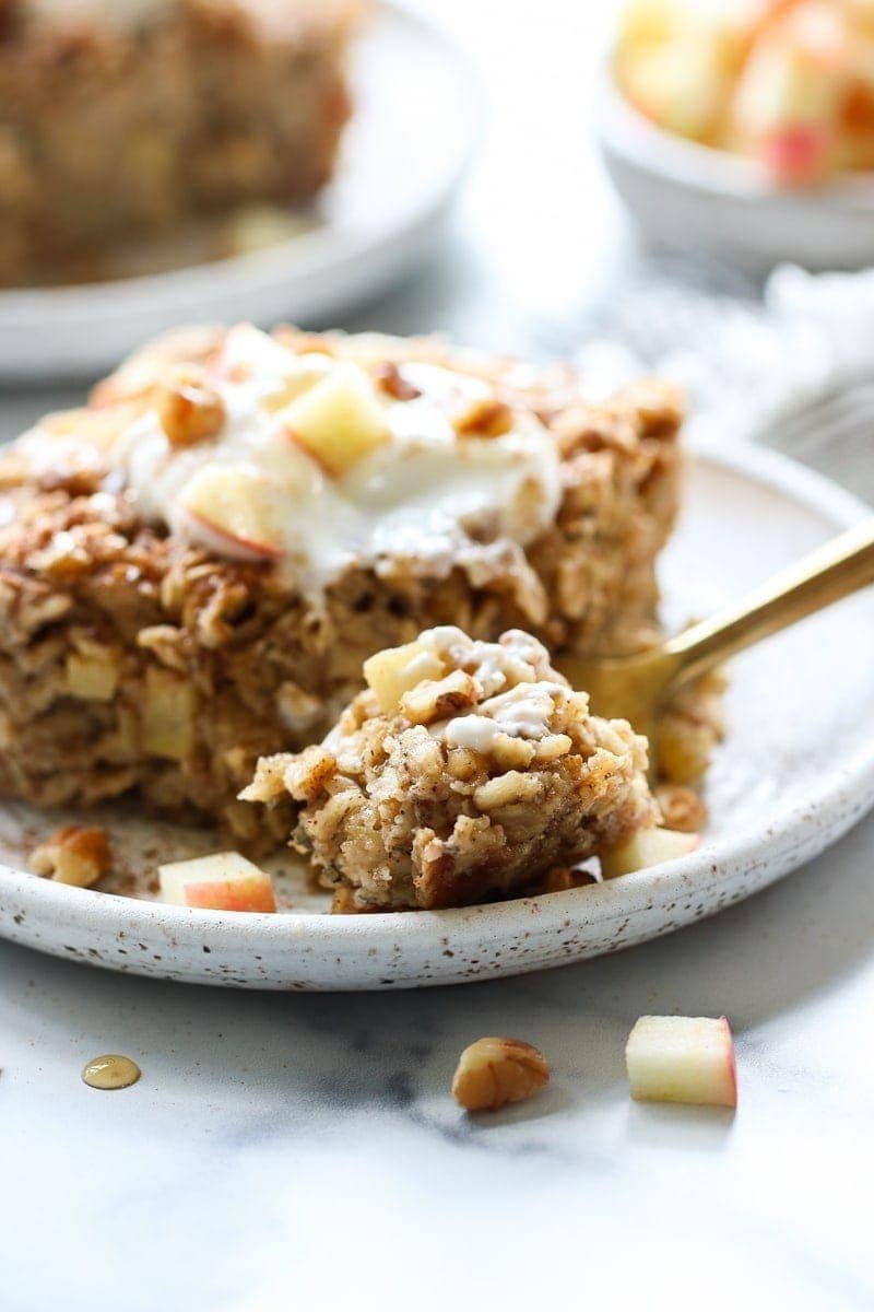 Slice of apple cinnamon baked oatmeal made with oats, apples, eggs, milk, and a dash of cinnamon.