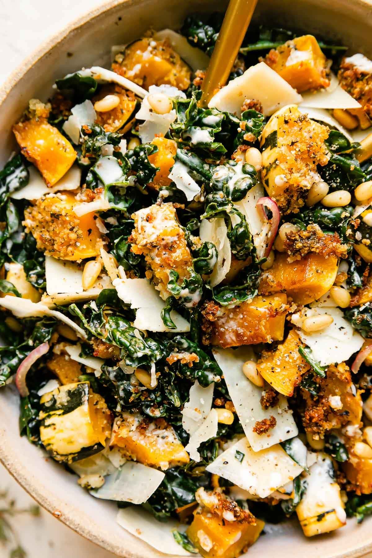 Bowl of Autumn Caesar Salad with Roasted Delicata Squash Croutons