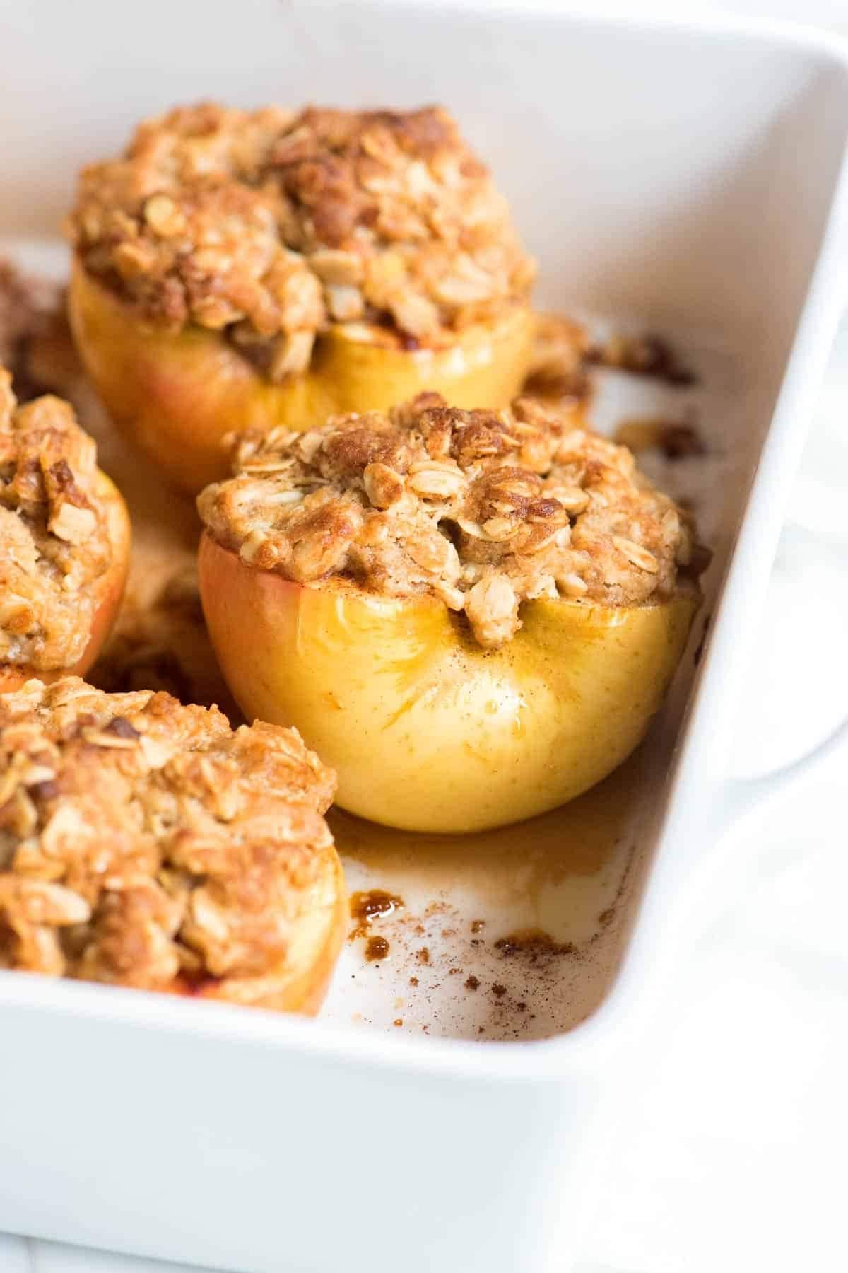 Easy baked cinnamon apples in a dish with layer of cinnamon sugar and a chewy oat topping. 