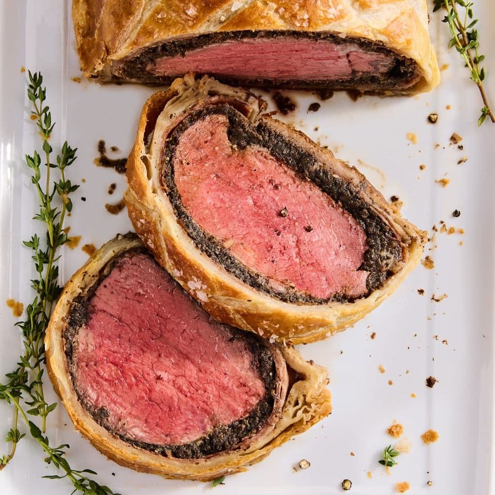 Sliced beef wellington wrapped in prosciutto