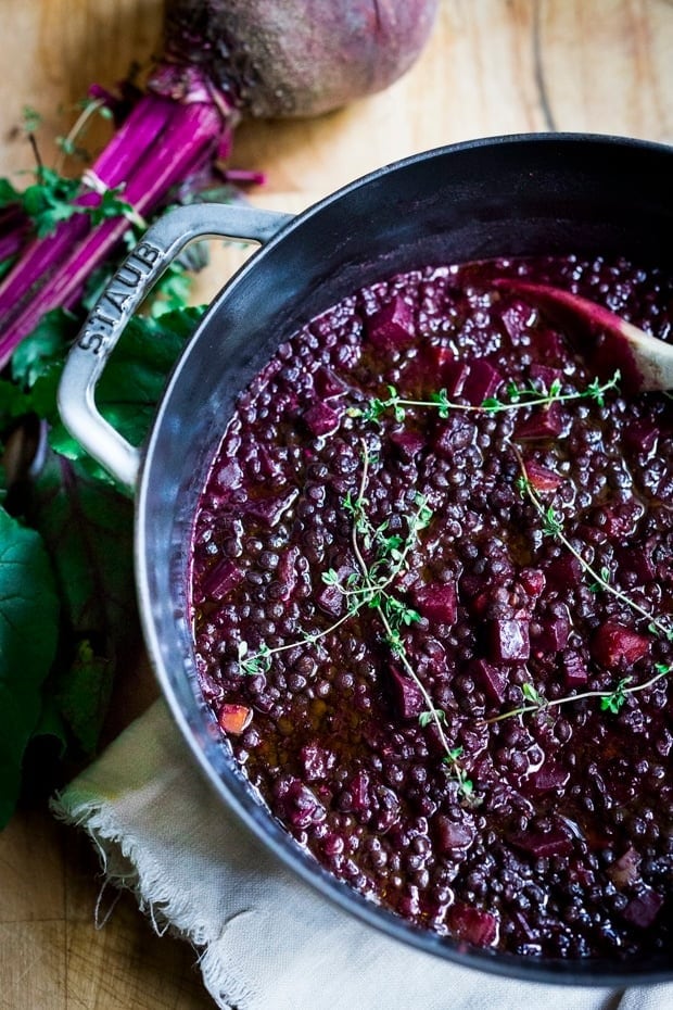 Braised lentils with beets in a pot. 