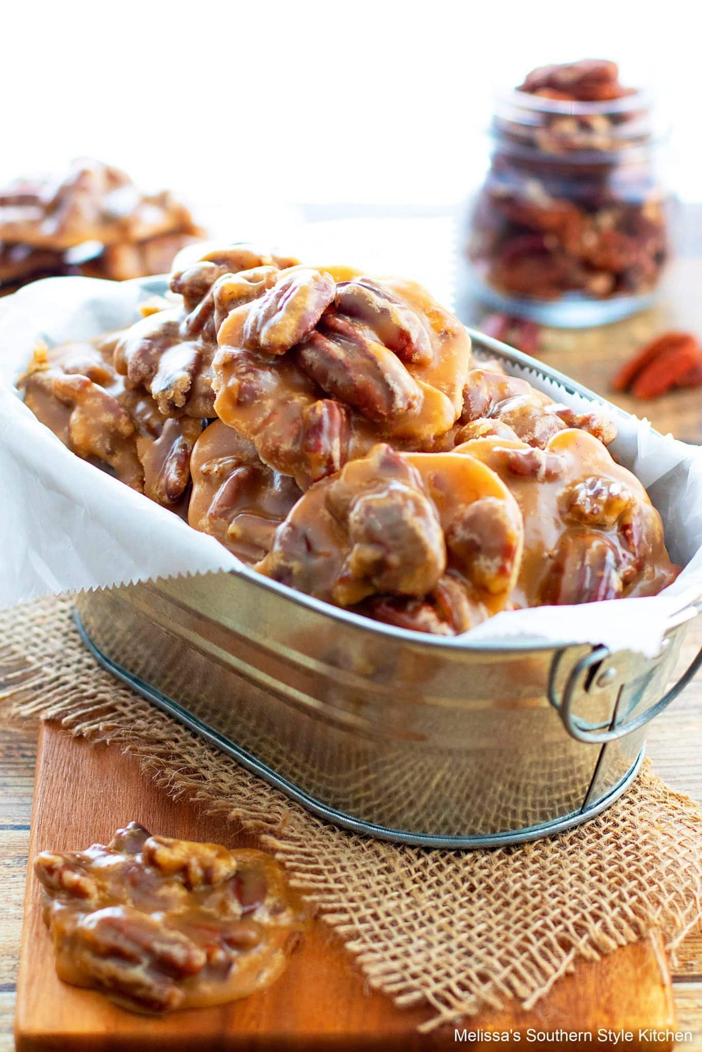 Bunch of Bourbon Pecan Pralines on a can with parchment paper