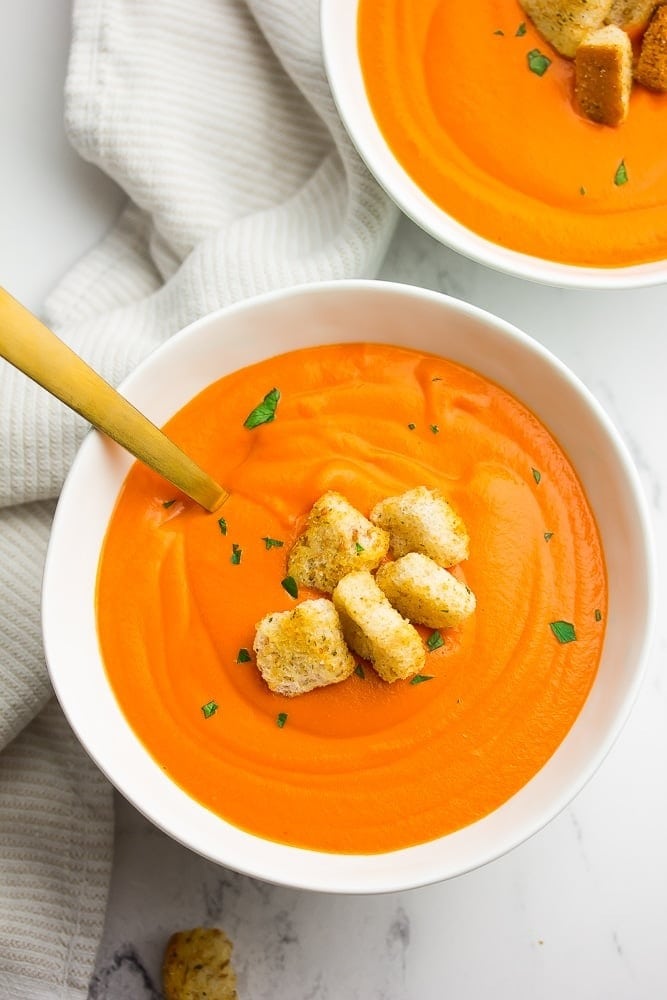 Bowls of homemade Tomato Soup  with croutons on top