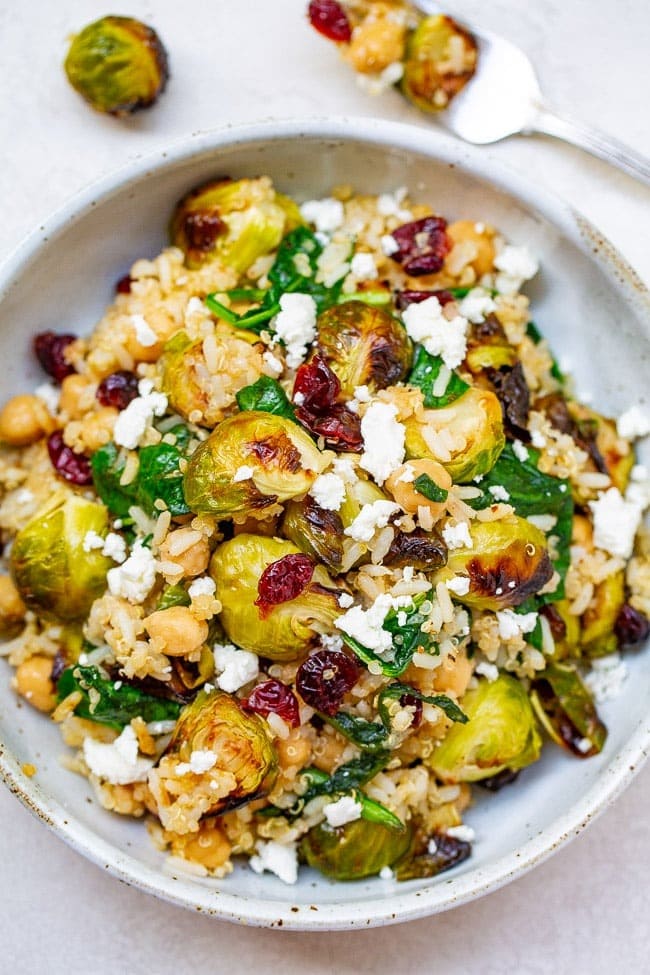 Roasted brussels sprouts quinoa chickpea salad in a bowl. 