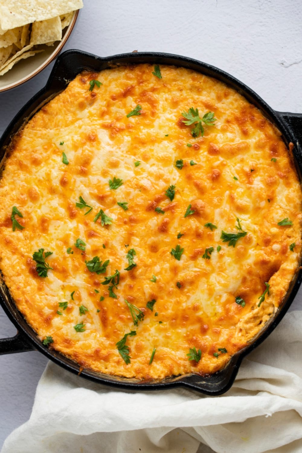 Top view of buffalo chicken dip in skillet. 