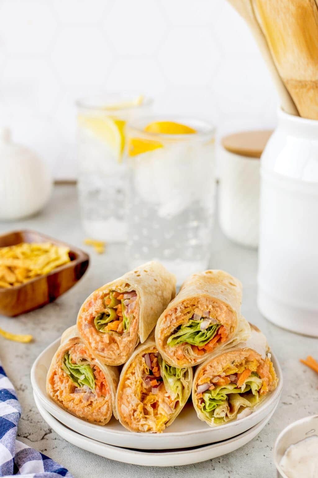 Homemade Buffalo Chicken Wraps with ranch dressing. carrots and lettuce