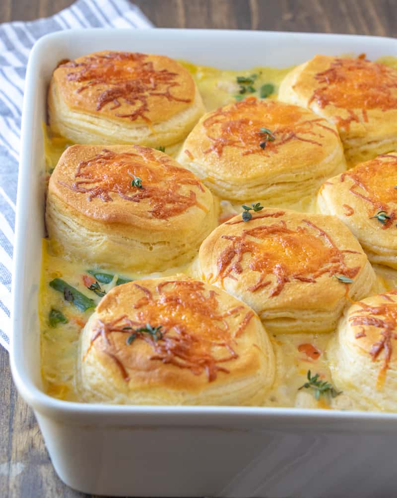 A savorychicken pot pie casserole dish brimming with a delightful blend of cheese and fresh vegetables.