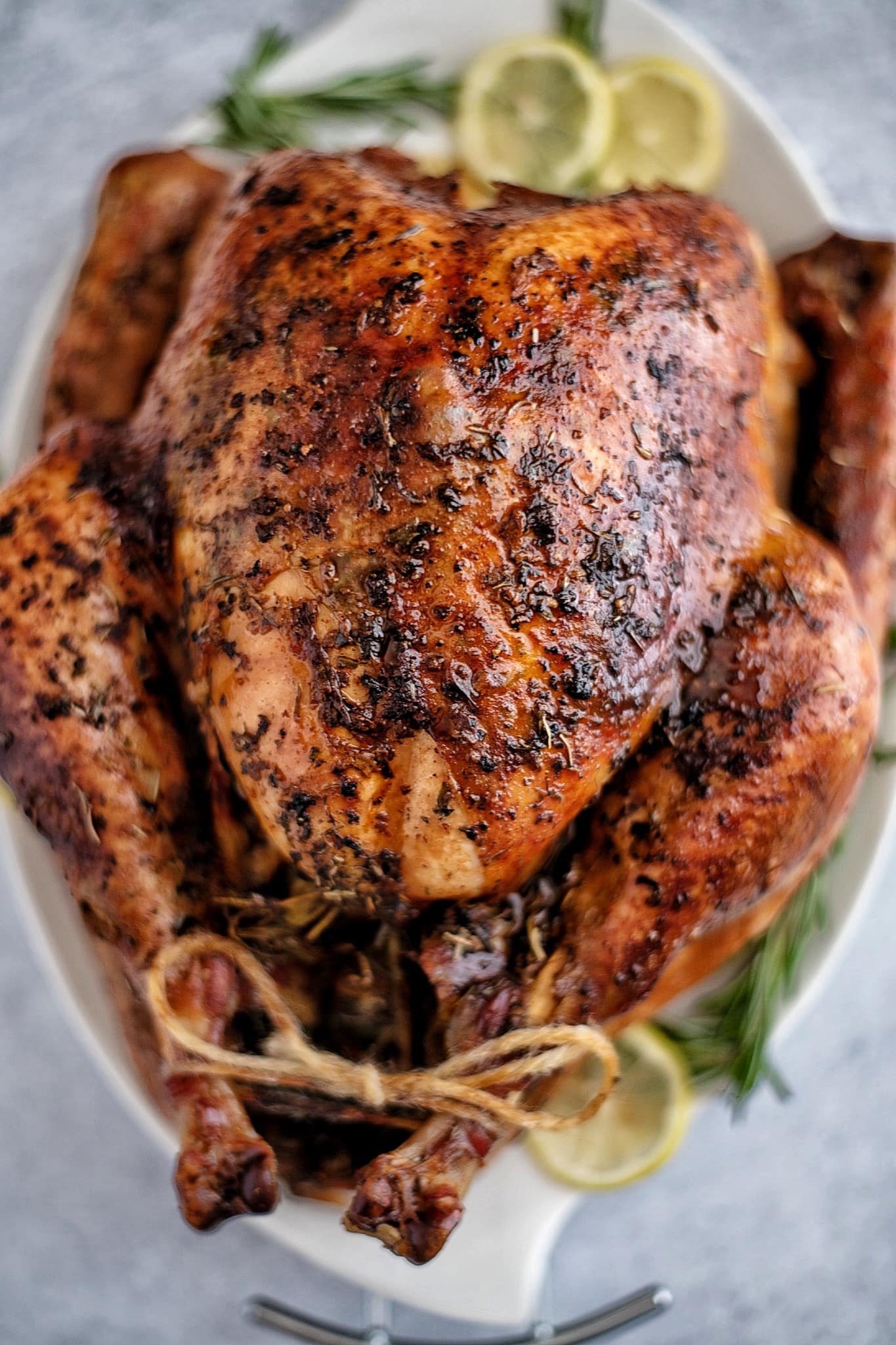 Cajun Butter Roasted Turkey garnish with rosemary and limewheel