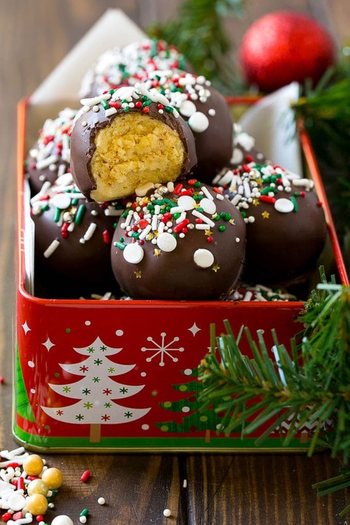 Delicious chocolate-covered Christmas truffles in a tin