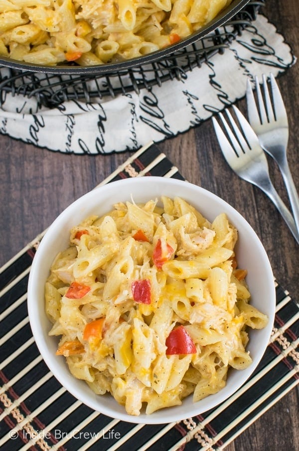 Bowl of Cheesy Chicken Pasta with penne pasta, bell pepper and cheddar jack cheese