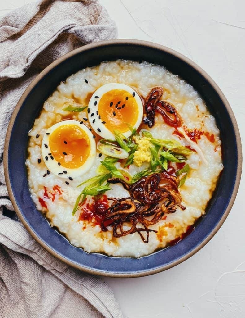 Chinese Chicken Congee with Eggs and Ginger in a Bowl