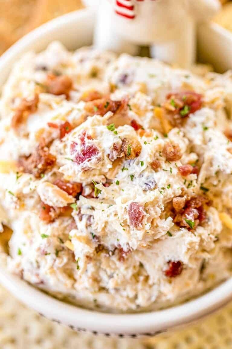 Bowl of Chicken Dip with bacon, ranch dressing. milk, cream and cheddar cheese
