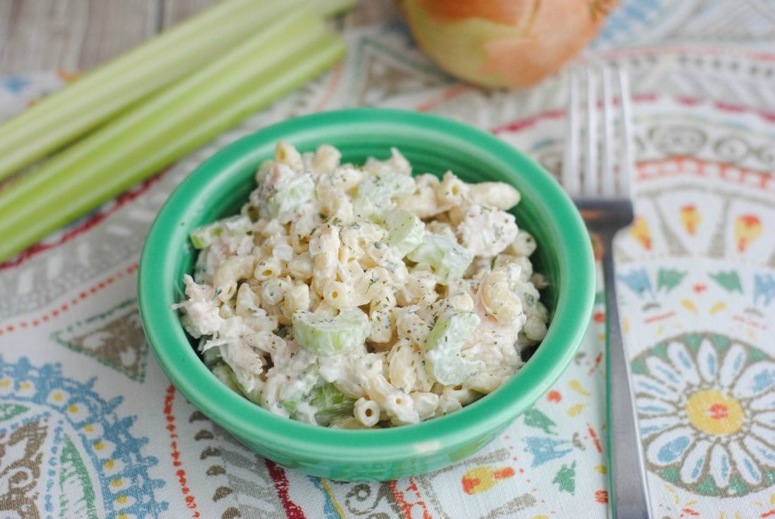 Bowl of Chicken Macaroni Salad with celery and garnished with pepper