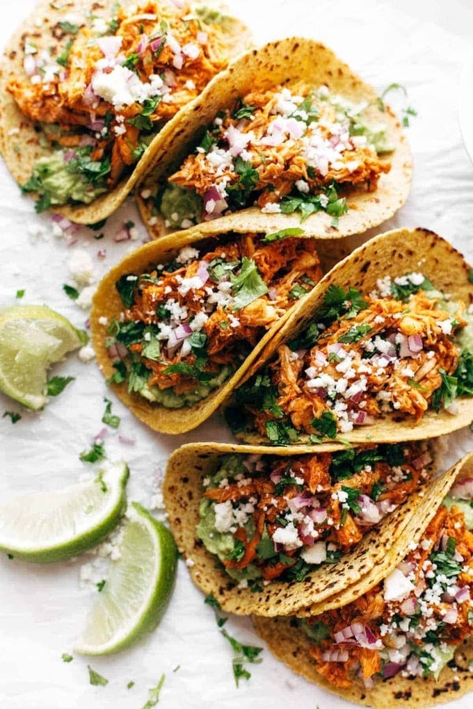 Chicken tinga tacos made with with spicy chipotle peppers in adobo sauce and fire-roasted tomatoes.