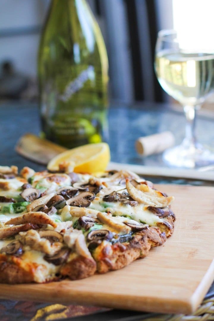 Homemade Roasted Chicken and Mushroom Pesto Pizza in a Wooden Board