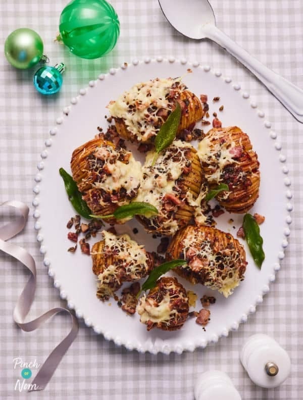 Hasselback potatoes topped with melted butter and bacon on top. 