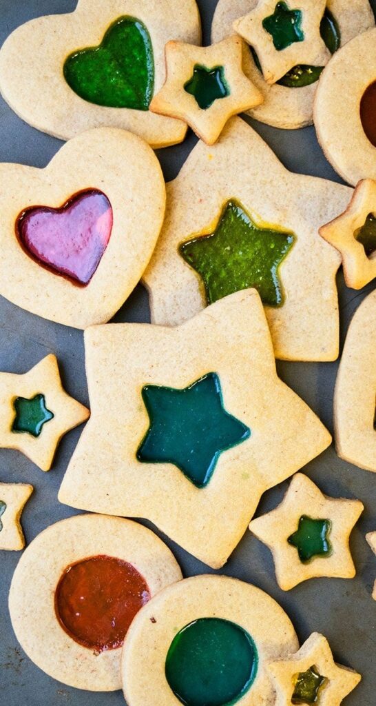 Star and heart shaped cookies with glass candy in  the middle. 