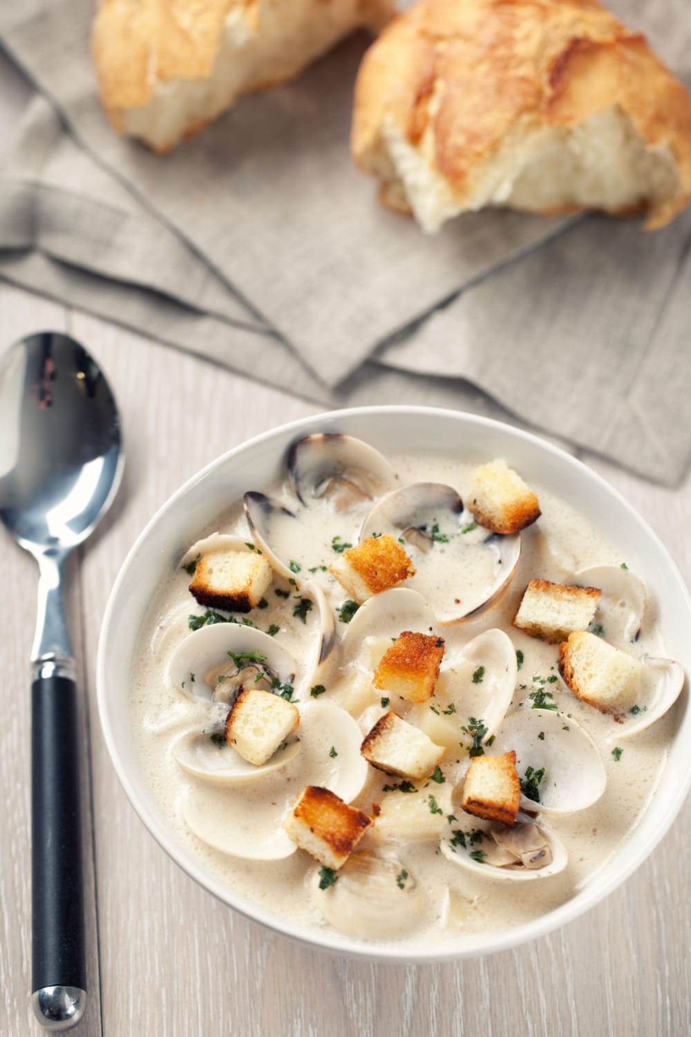 New England clam chowder with toasted croutons on top. 