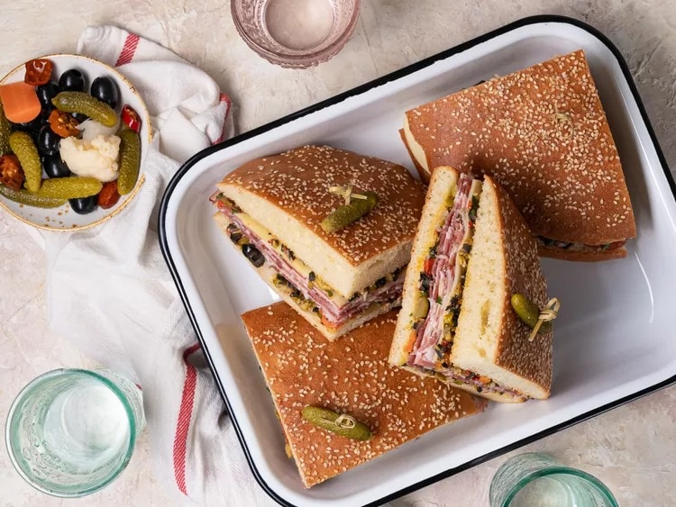 Muffuletta Sandwich with Meat, Olives, Capers and Parsley
