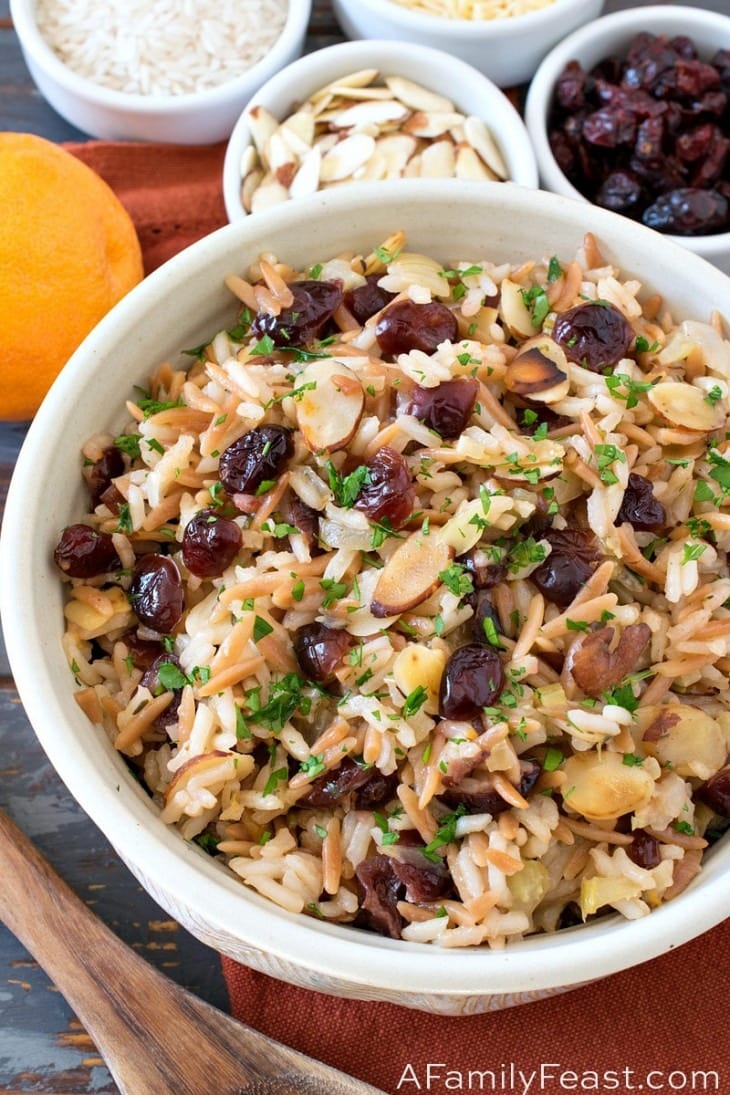 A bowl of cranberry rice pilaf made with rice, nuts and cranberries. 