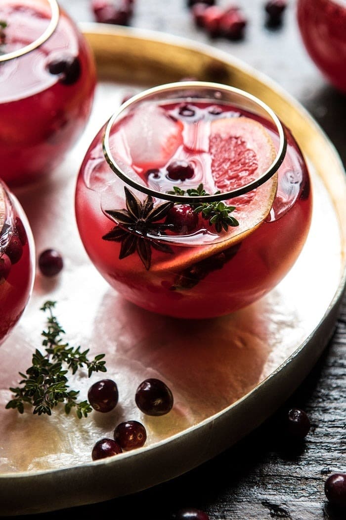 Glasses of Cranberry Thyme Spritz served on a  metal tray