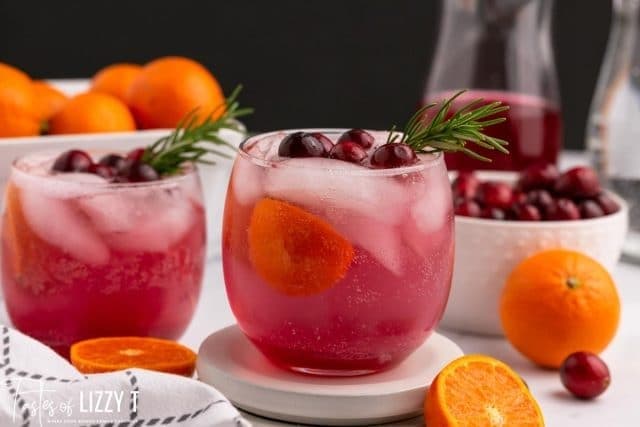 Two glasses of iced cranberry and orange punch. 