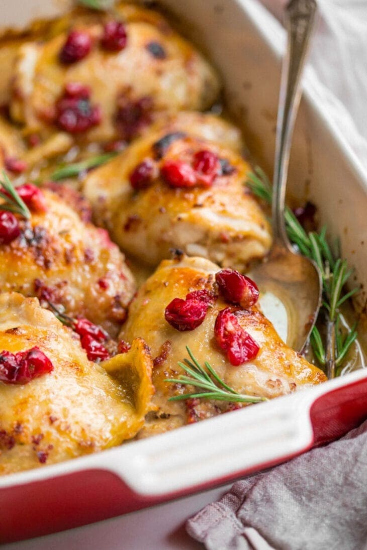 Cranberry rosemary chicken on a casserole dish. 