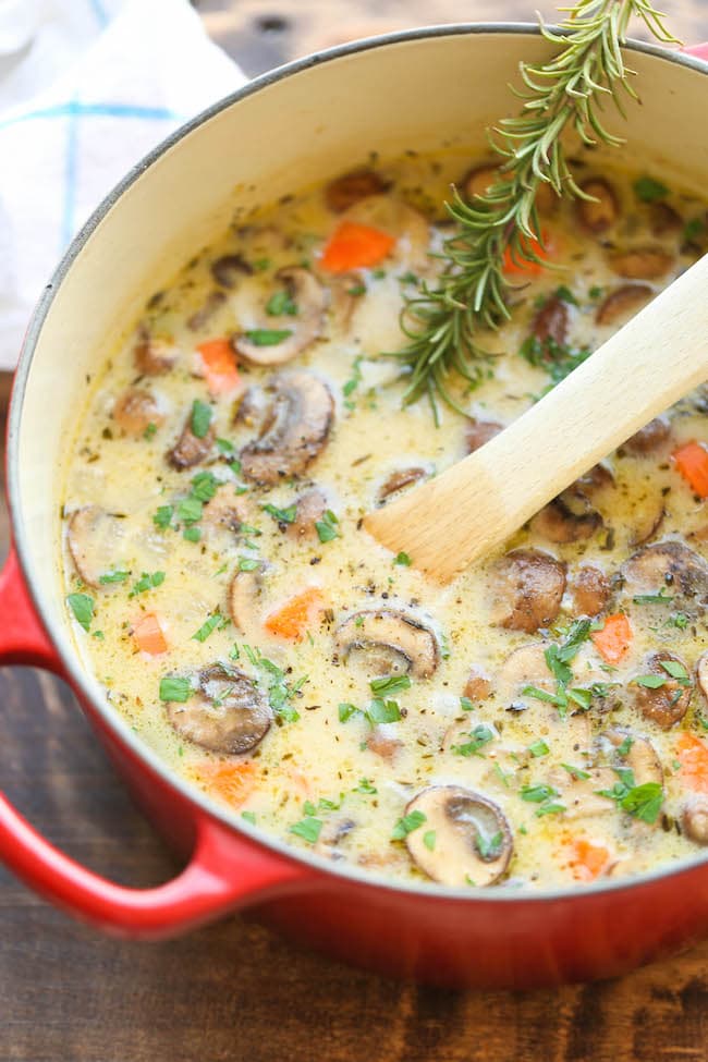 A pot of chicken and mushroom soup, simmering on a stove. A warm and comforting dish, perfect for a cozy meal
